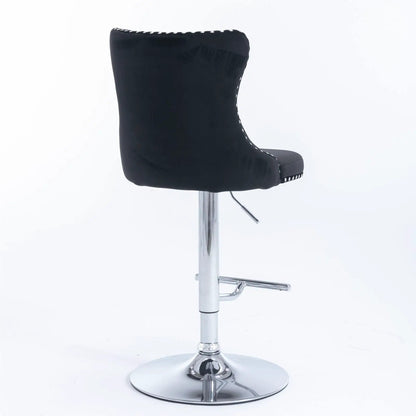 Black faux-leather swivel bar stool with tufted back and chrome base, adjustable height lever on Tampa Home & Garden Store
