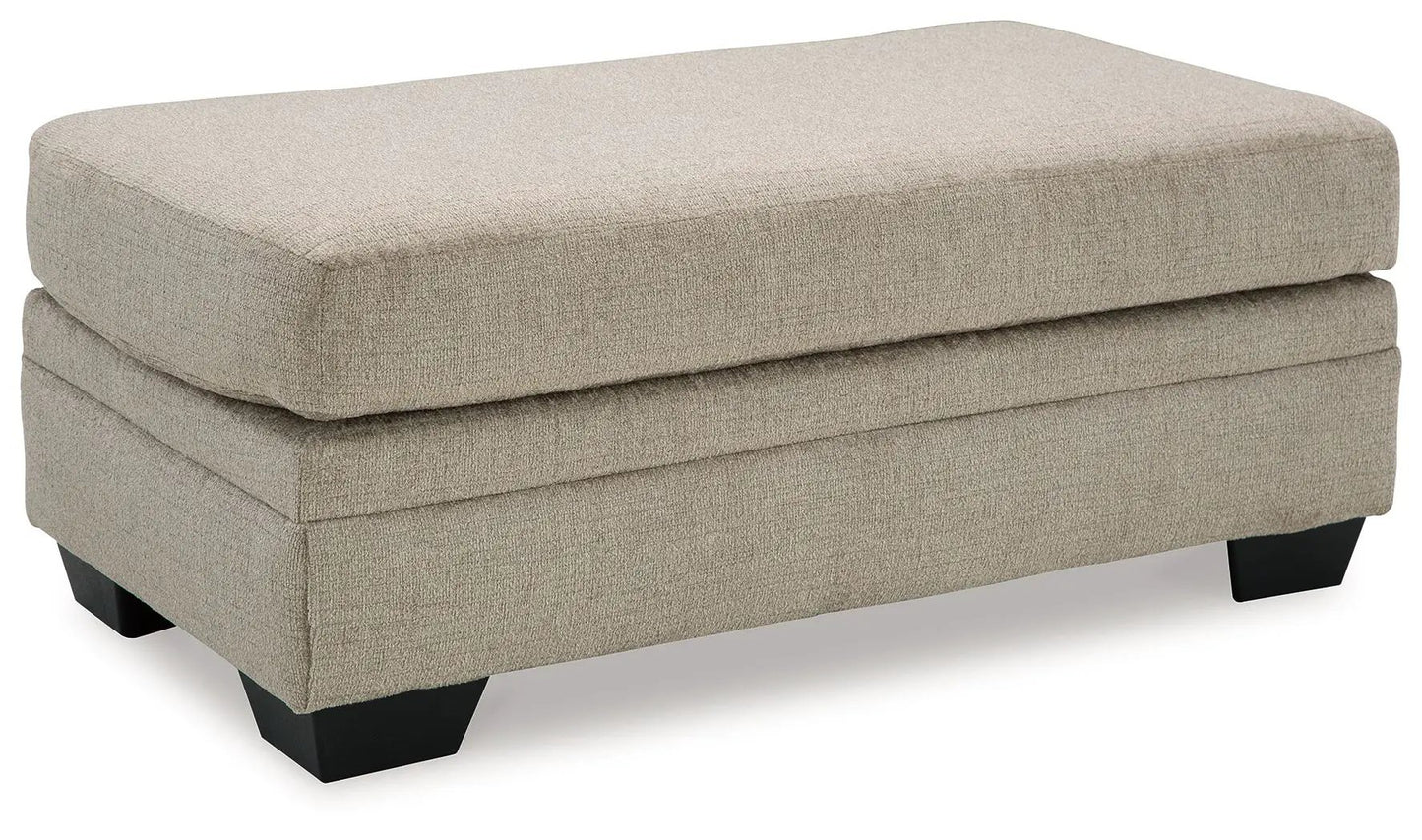Stonemeade ottoman beige fabric rectangular top black legs on Tampa Home & Garden Store
