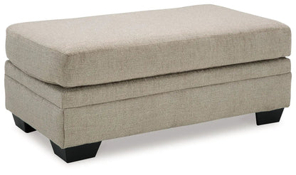 Stonemeade ottoman beige fabric rectangular top black legs on Tampa Home & Garden Store