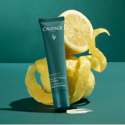 Caudalie Vinergetic C+ 3-in-1 Vitamin C moisturizer tube teal packaging with lemon backdrop on Tampa Home & Garden Store