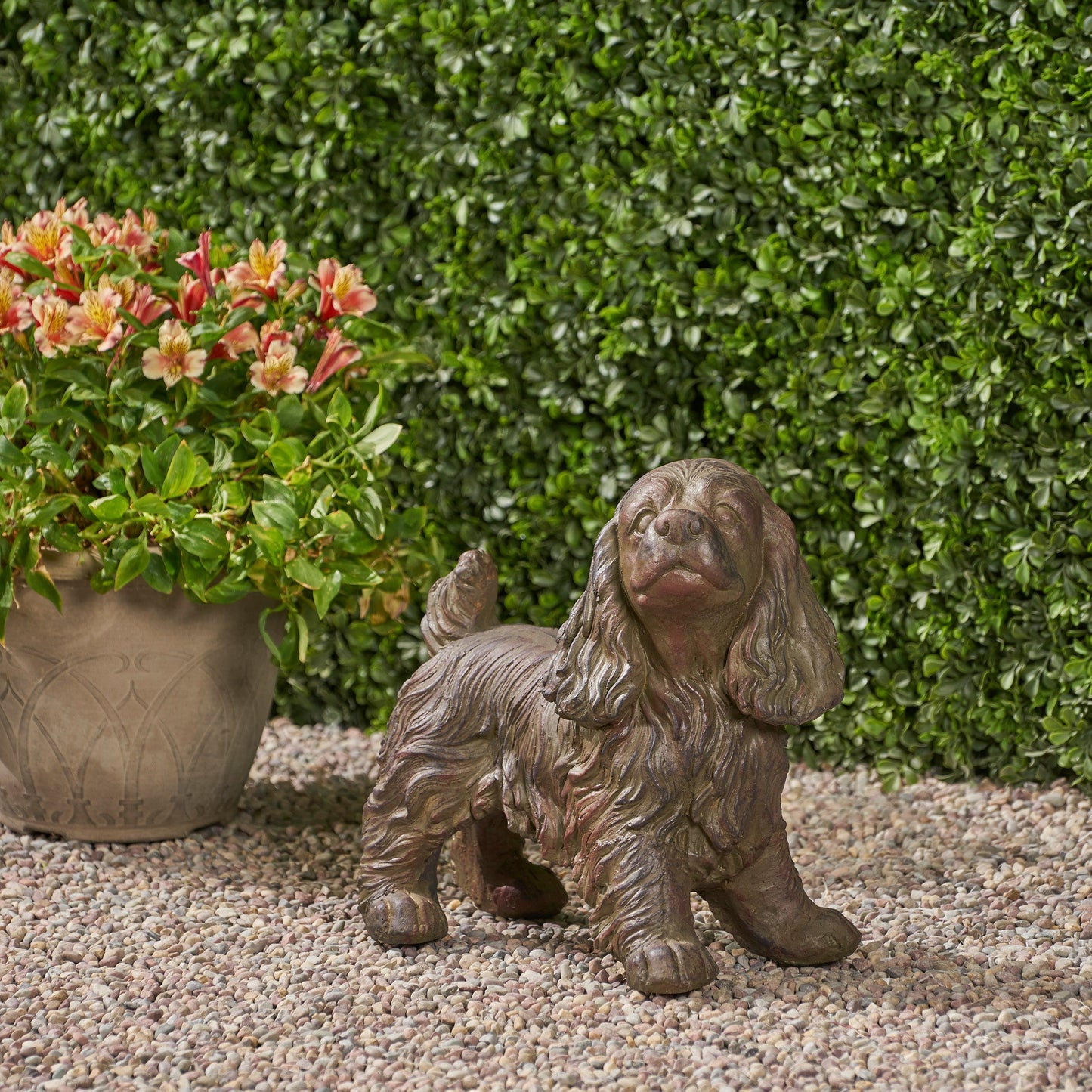 Josie Dog Cast Stone Garden Statue set of 3 brown textured dogs beside flowering pot on Tampa Home & Garden Store