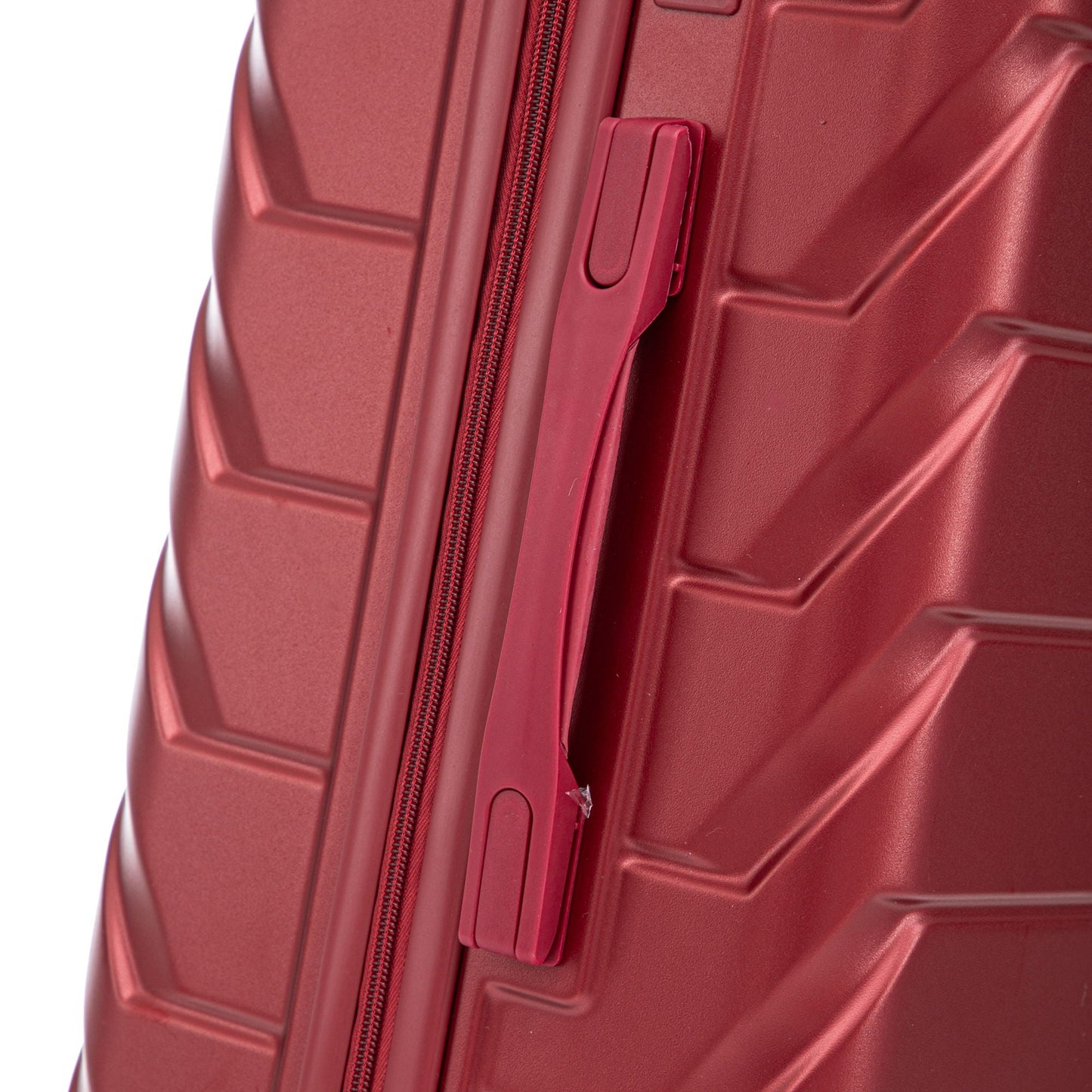 Red hard-shell luggage side with zipper and built-in strap latch, close-up on Tampa Home & Garden Store