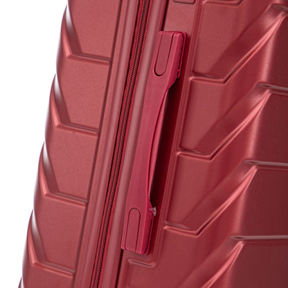 Red hard-shell luggage side with zipper and built-in strap latch, close-up on Tampa Home & Garden Store