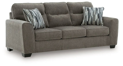 Olten stationary chair & ottoman in taupe fabric with striped accent pillows on Tampa Home & Garden Store