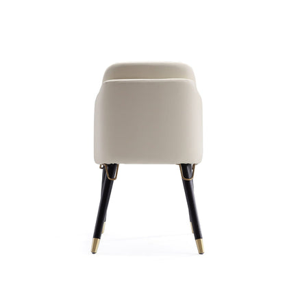 Estelle Dining Chair beige upholstery with metal accents, dark legs with brass caps on Tampa Home & Garden Store