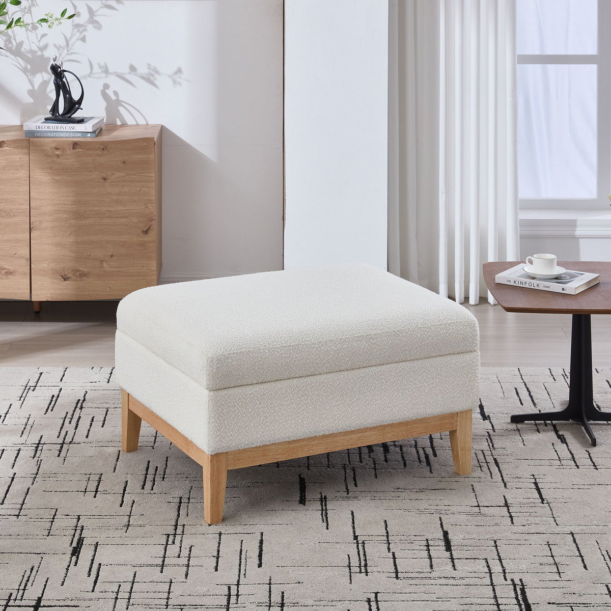Upholstered storage ottoman with reversible lid in cream fabric and wood legs on Tampa Home & Garden Store