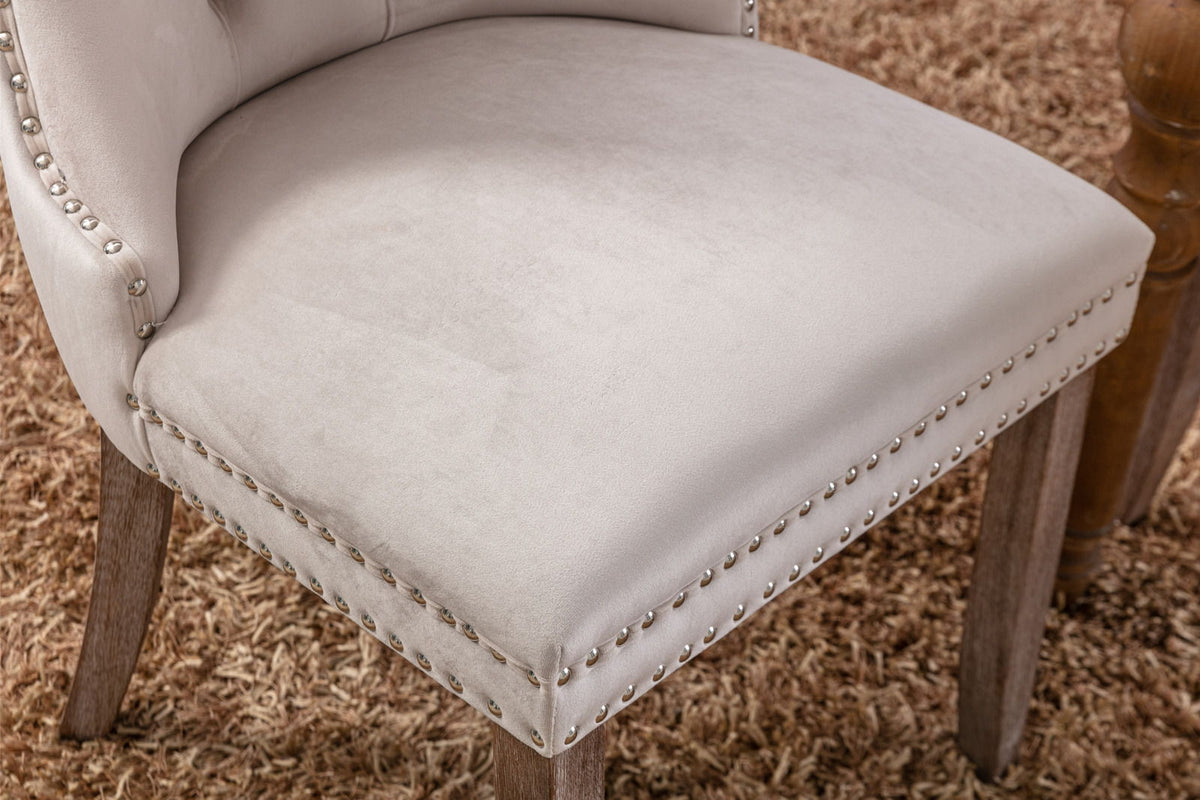 Tufted velvet dining chair beige upholstery with silver nailhead trim wood legs on Tampa Home & Garden Store