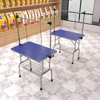 Two large blue pet grooming tables with adjustable arms and clamps, heavy-duty design on Tampa Home & Garden Store