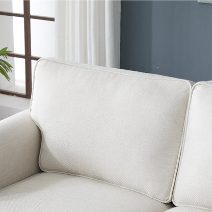 Beige fabric sofa with rounded rolled arm and piping edges on Tampa Home & Garden Store