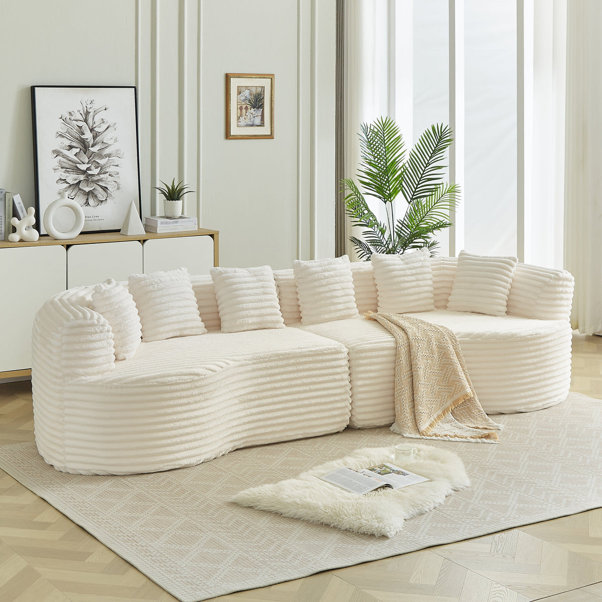 White curved sectional sofa with ribbed fabric and oversized cushions in a living room on Tampa Home & Garden Store