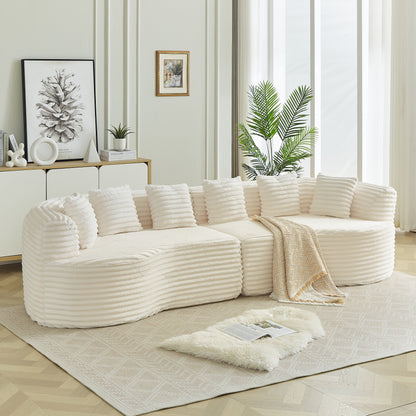 White curved sectional sofa with ribbed fabric and oversized cushions in a living room on Tampa Home & Garden Store