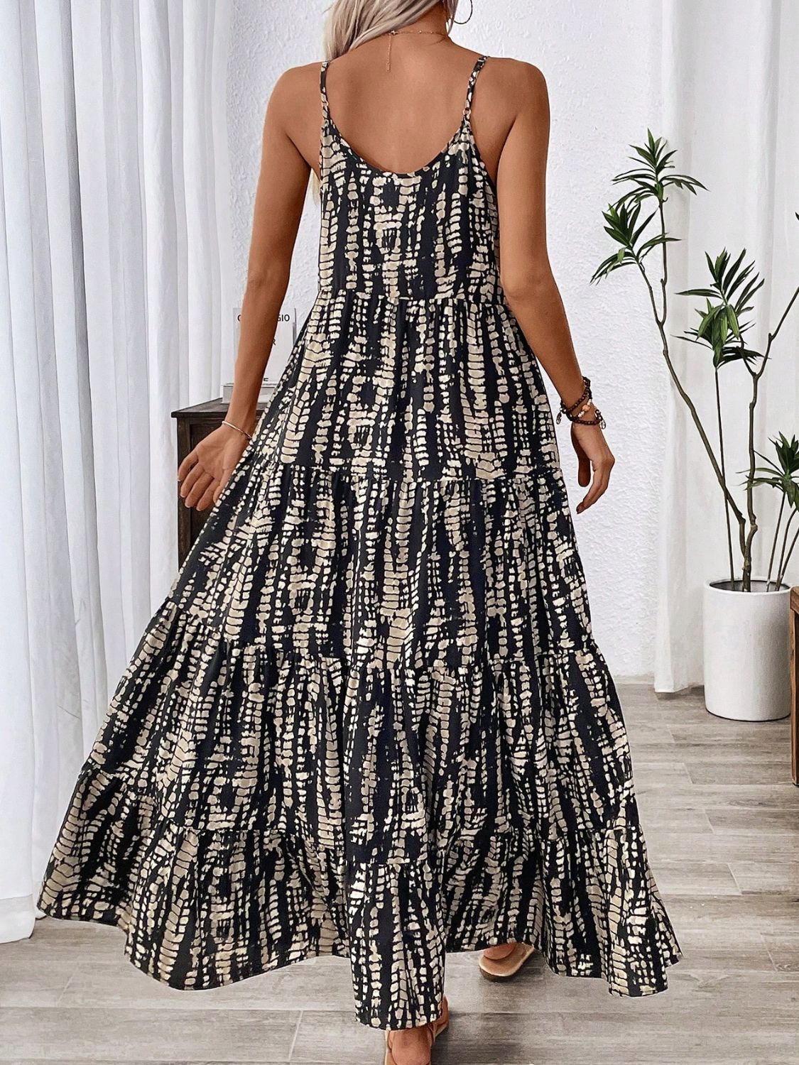 Stevvex black printed maxi dress with beige pattern, spaghetti straps, tiered skirt on Tampa Home & Garden Store