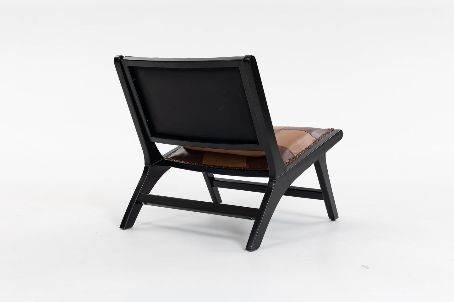 Modern Boho Accent Chair by HouseOfZazla with black frame and brown leather cushion on Tampa Home & Garden Store