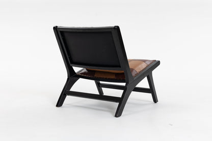 Modern Boho Accent Chair by HouseOfZazla with black frame and brown leather cushion on Tampa Home & Garden Store