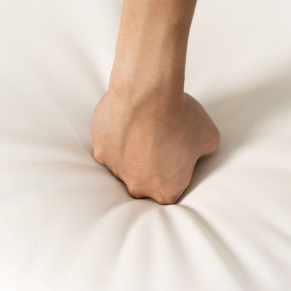 Forearm close-up resting on light beige fabric background on Tampa Home & Garden Store
