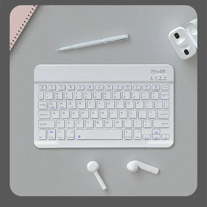Wireless Mouse For Tablets And Laptops white keyboard desk setup with pen and earbuds on Tampa Home & Garden Store