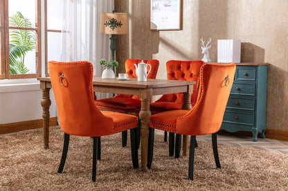 Tufted dining chair set in orange velvet with nailhead trim and dark wood legs on Tampa Home & Garden Store