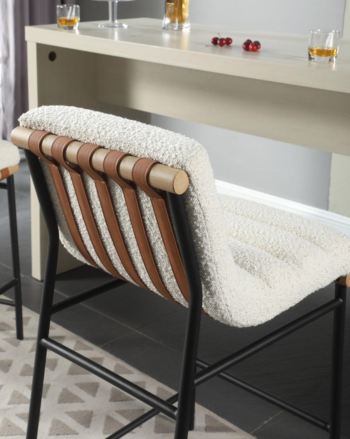 Lahni Boucle Counter Height Chair by HouseOfZazla, cream boucle seat with tan leather straps on Tampa Home & Garden Store
