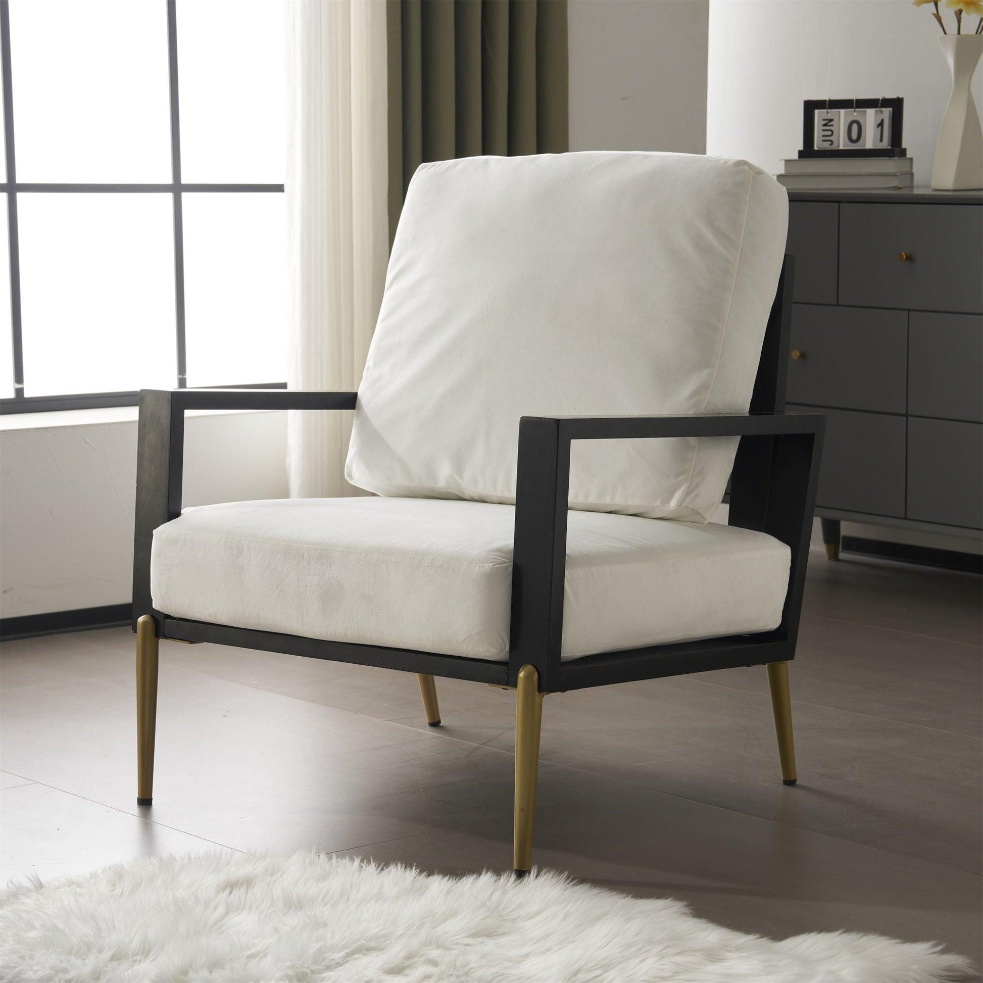 Modern Armchair with solid black wood frame and white cushions on Tampa Home & Garden Store