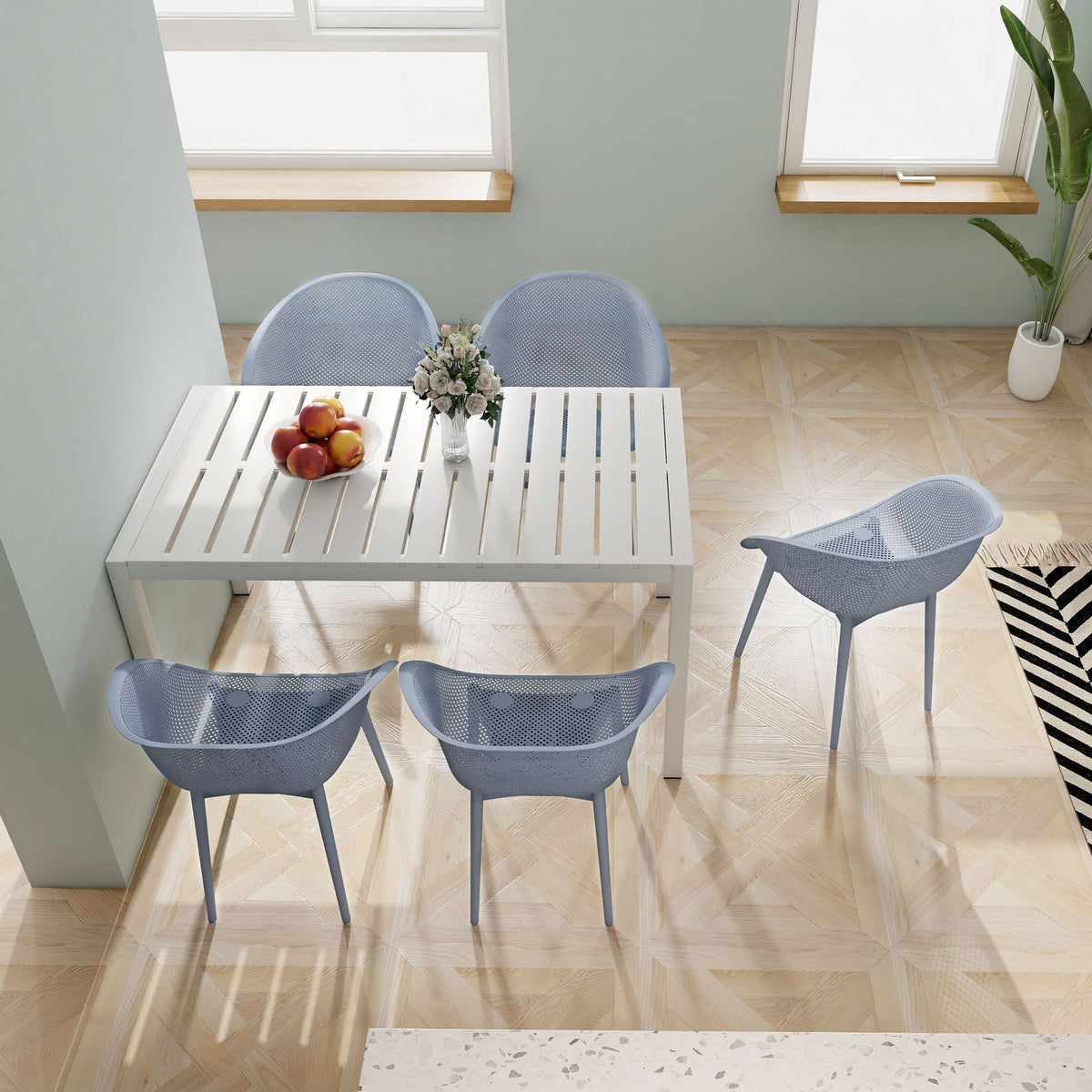 5 piece outdoor set with long white slatted table and four blue-gray chairs in bright space on Tampa Home & Garden Store