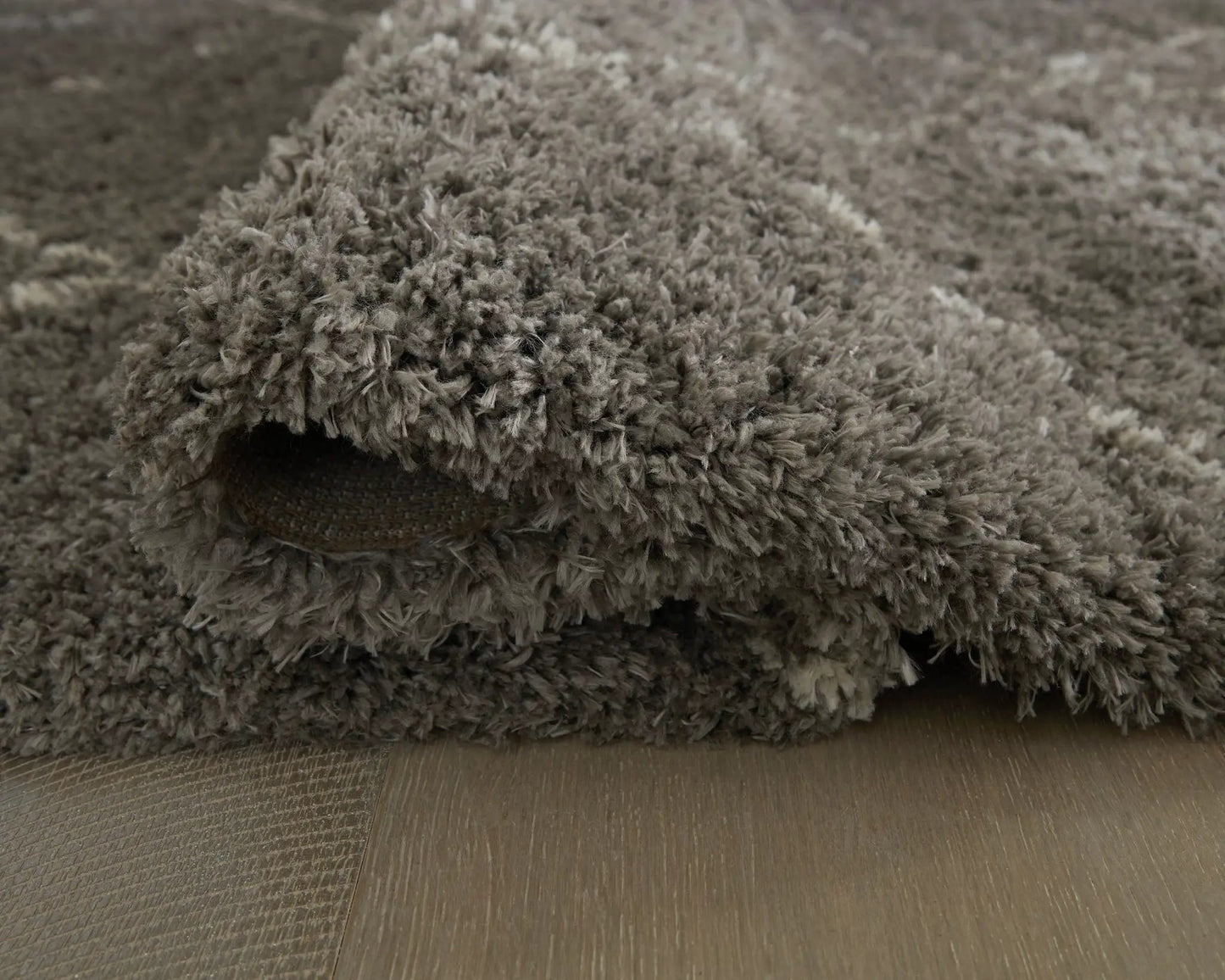 Wrenlow area rug with plush gray-brown shag pile, Unique Piece Furniture on Tampa Home & Garden Store