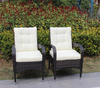 Three Liberatore outdoor dining chairs with beige cushions and dark wicker frames on Tampa Home & Garden Store