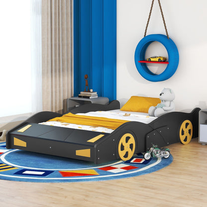Race car shaped platform bed with wheels and storage, black frame with yellow wheel accents on Tampa Home & Garden Store