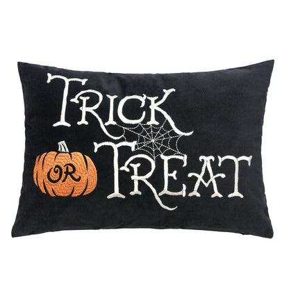 Halloween lumbar pillow black with white Trick or Treat embroidery and orange pumpkin on Tampa Home & Garden Store