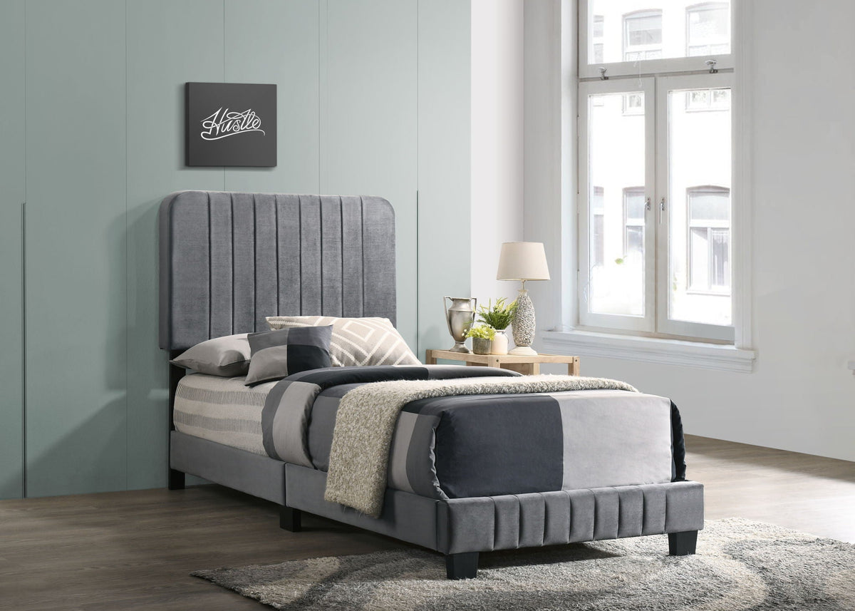 Channel Tufted Bed in gray upholstery with a tall vertical tufted headboard in a modern bedroom on Tampa Home & Garden Store