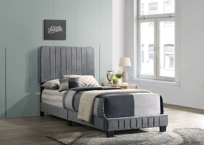 Channel Tufted Bed in gray upholstery with a tall vertical tufted headboard in a modern bedroom on Tampa Home & Garden Store