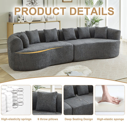 Curved sectional sofa in dark gray boucle with multiple cushions in a bright living room on Tampa Home & Garden Store