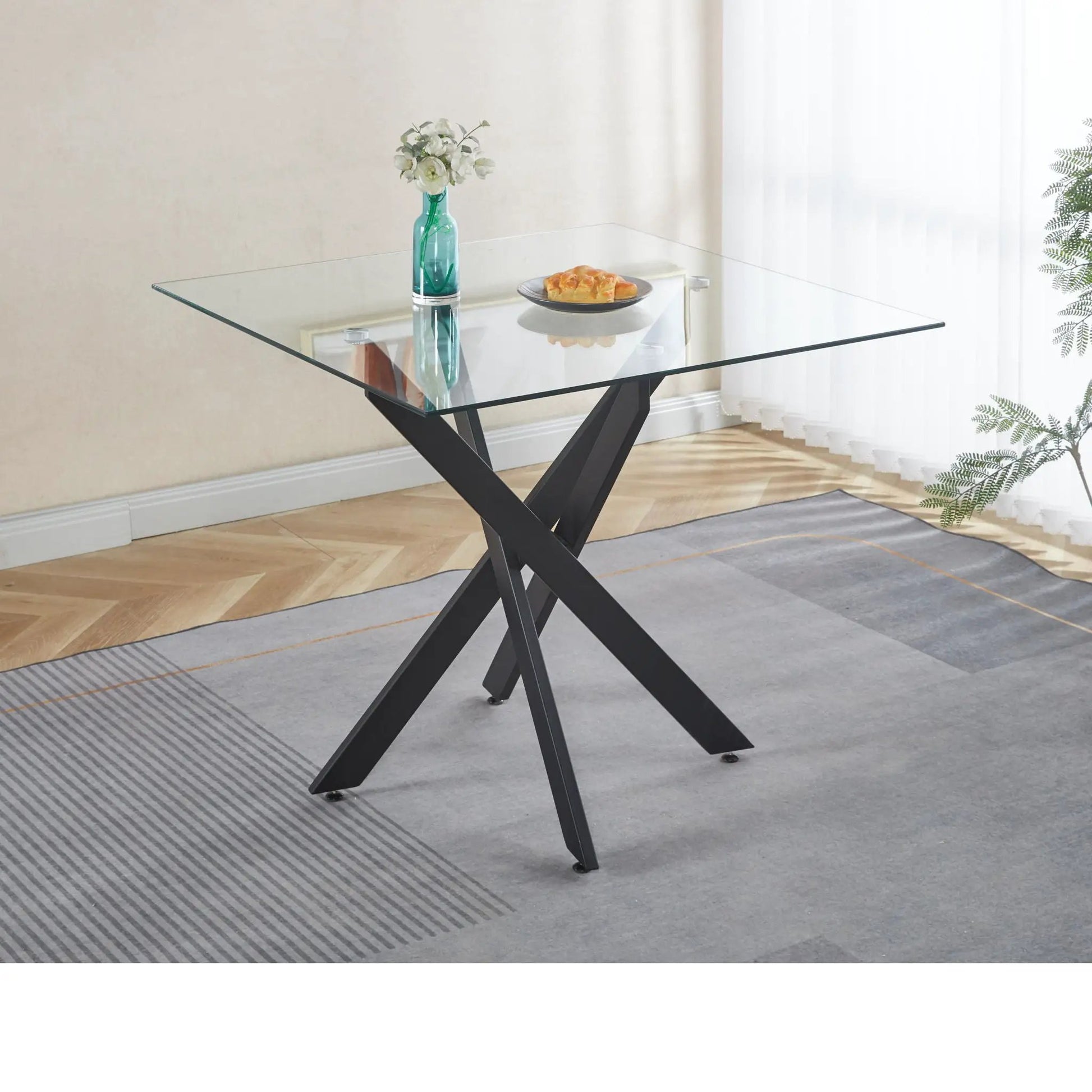 Dining table with cross metal legs and square tempered glass top on Tampa Home & Garden Store
