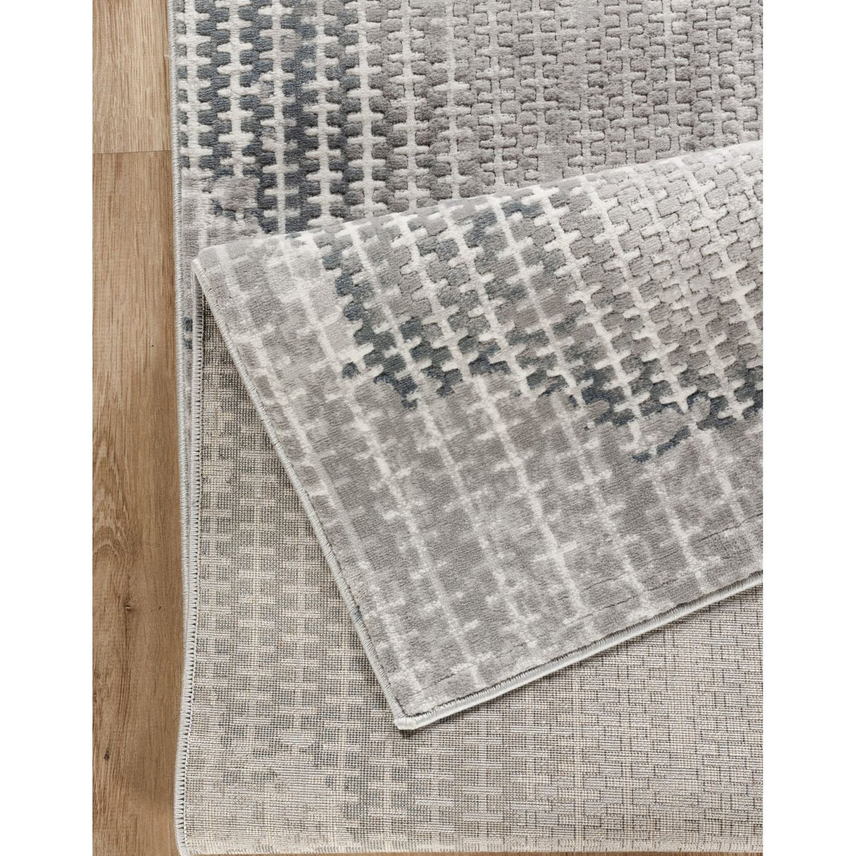 Gray contemporary area rug Geometrix pattern by HouseOfZazla on hardwood floor on Tampa Home & Garden Store