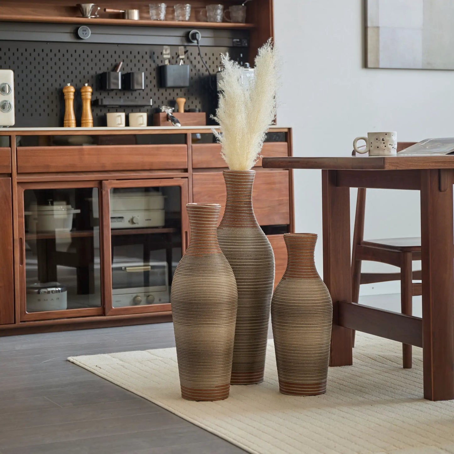 Set of 3 tall ribbed floor vases in warm beige tones with pampas grass on Tampa Home & Garden Store
