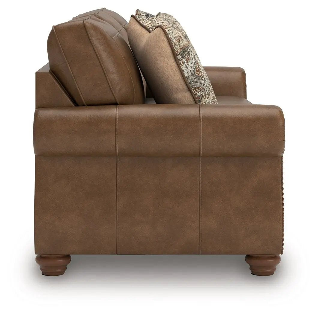 Chasemore Sofa stationary brown leather with plush back cushions and wood bun feet on Tampa Home & Garden Store