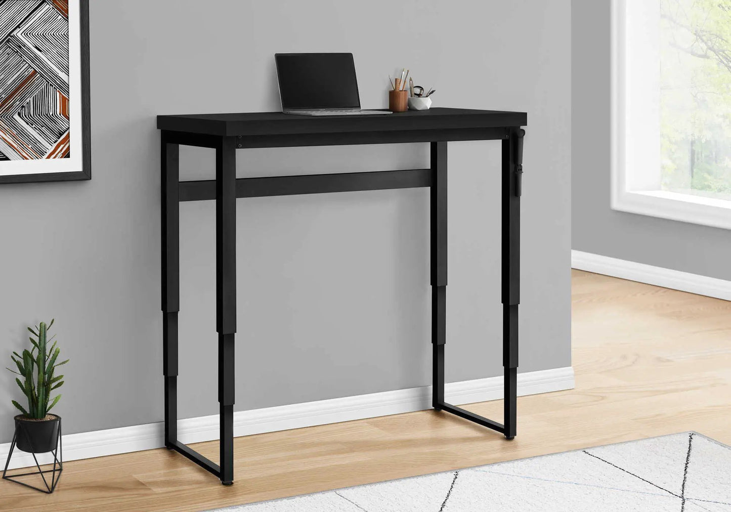 Standing adjustable black metal computer desk for home office with laptop on Tampa Home & Garden Store