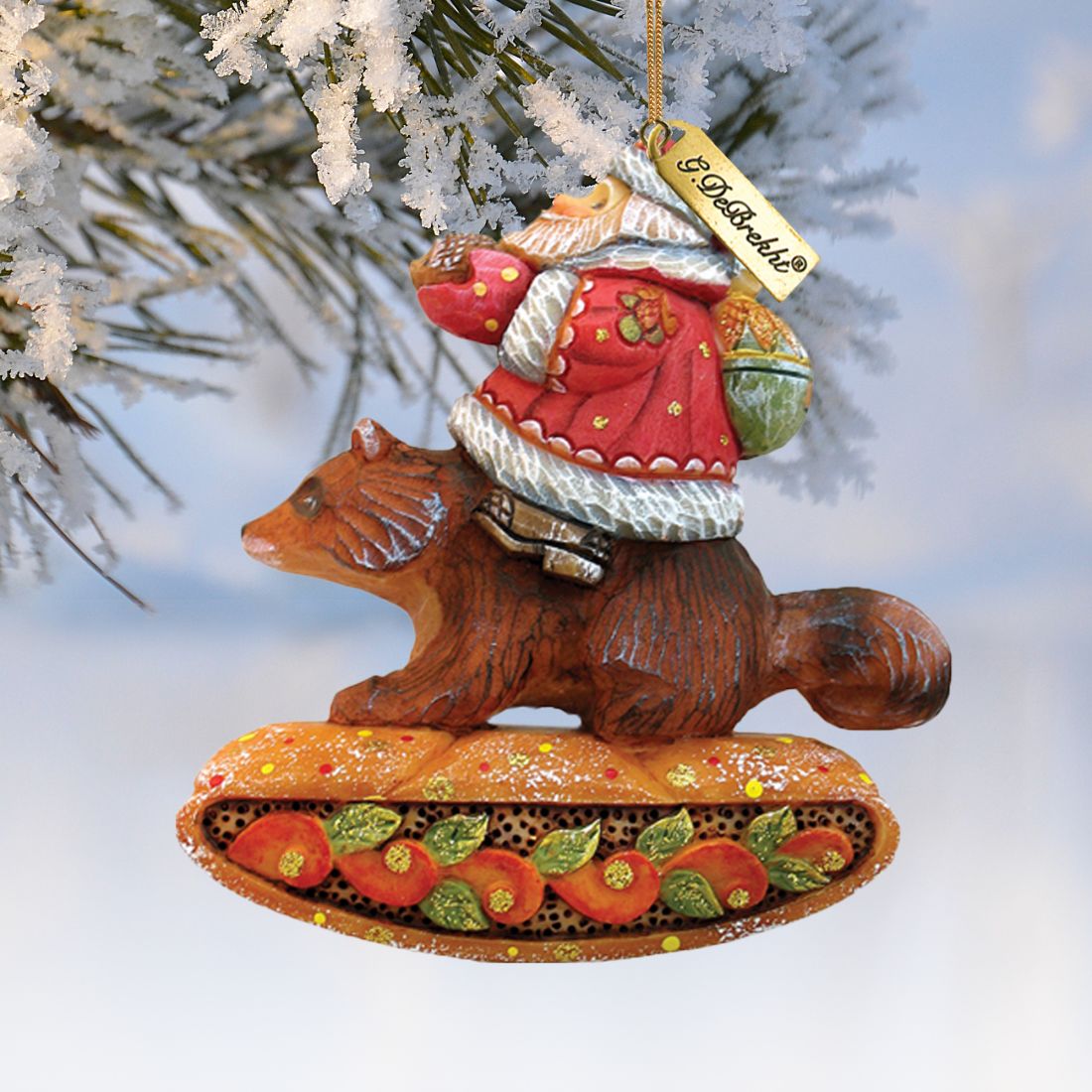 Santa on raccoon ornament by G. DeBrekht, red coat on brown raccoon with orange base on Tampa Home & Garden Store