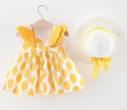 Stevvex baby dress with yellow polka dots and butterfly wing straps, matching straw hat on Tampa Home & Garden Store
