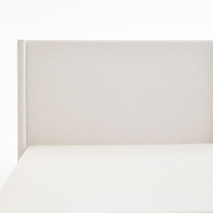 Hosford minimalist upholstered wingback bed headboard in cream fabric, close-up on Tampa Home & Garden Store
