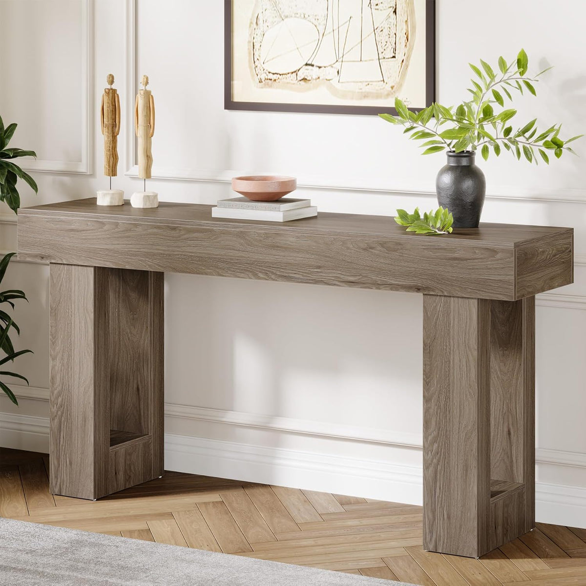 Extra long narrow console table in gray-brown wood finish with open shelf and two figurines on Tampa Home & Garden Store