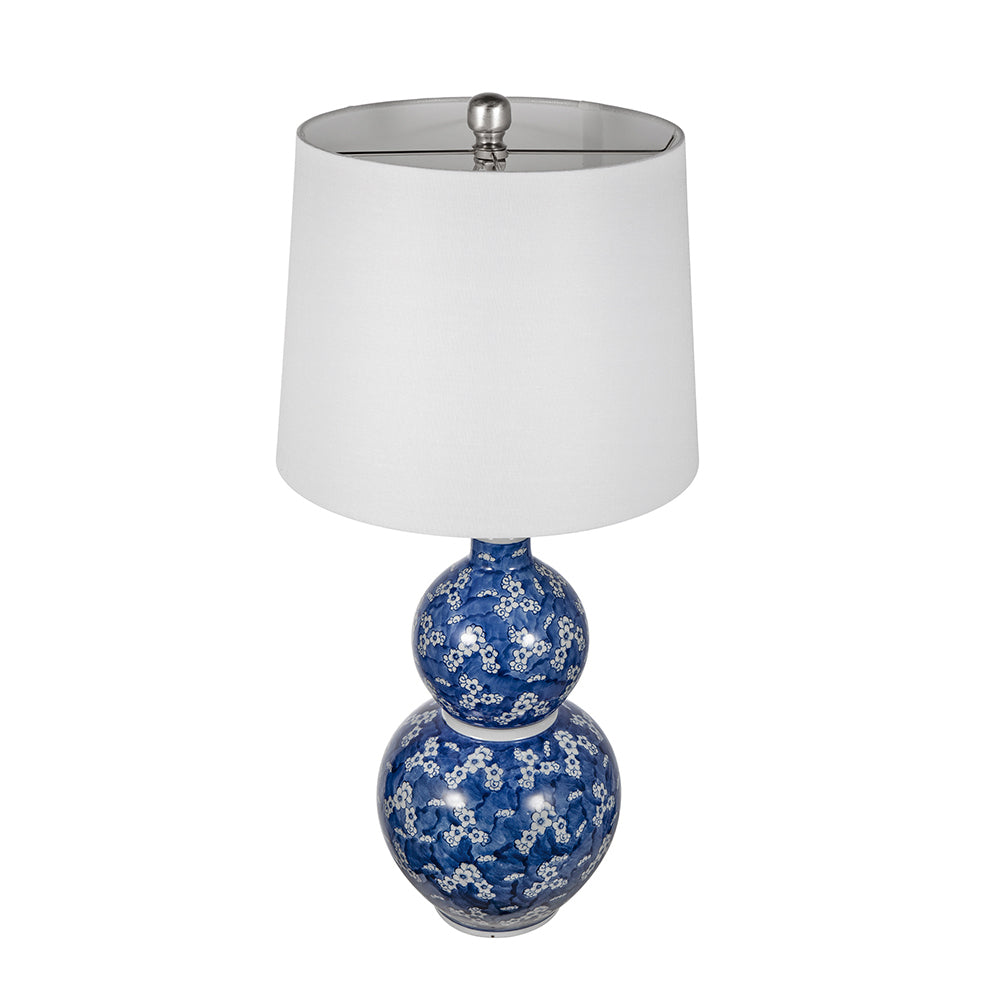 Two-tier blue and white ceramic vase lamp by HouseOfZazla with white shade on Tampa Home & Garden Store