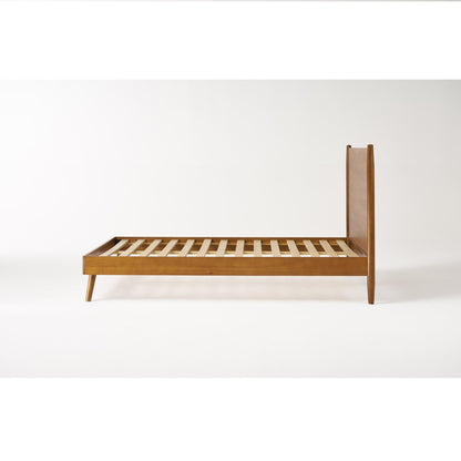 Mid-Century wooden platform bed frame in light brown with slatted base and slender legs on Tampa Home & Garden Store