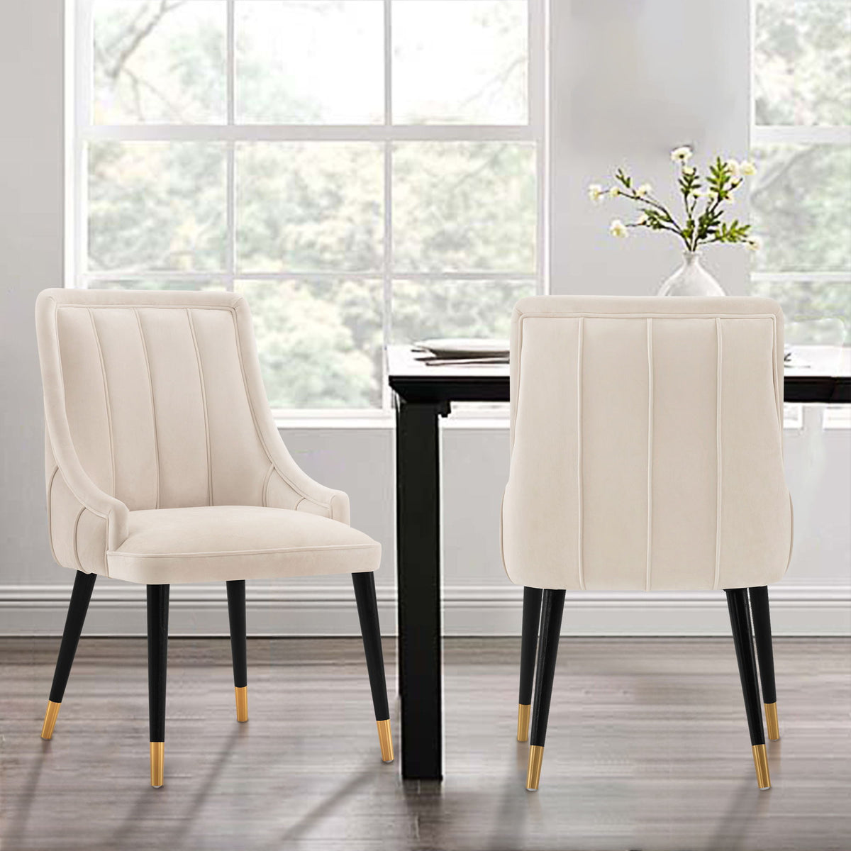 Eda Dining Chair with stitched ivory upholstery, two cream arm chairs with black legs on Tampa Home & Garden Store