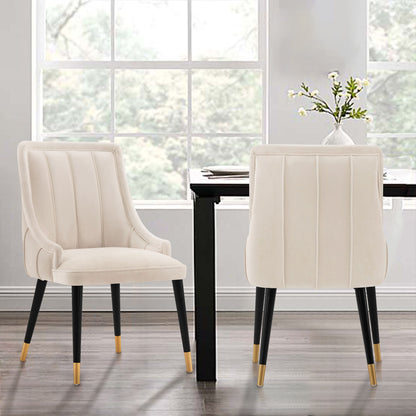 Eda Dining Chair with stitched ivory upholstery, two cream arm chairs with black legs on Tampa Home & Garden Store