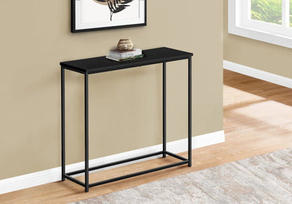 Accent console table with black metal frame in entryway, books and wicker lamp on Tampa Home & Garden Store