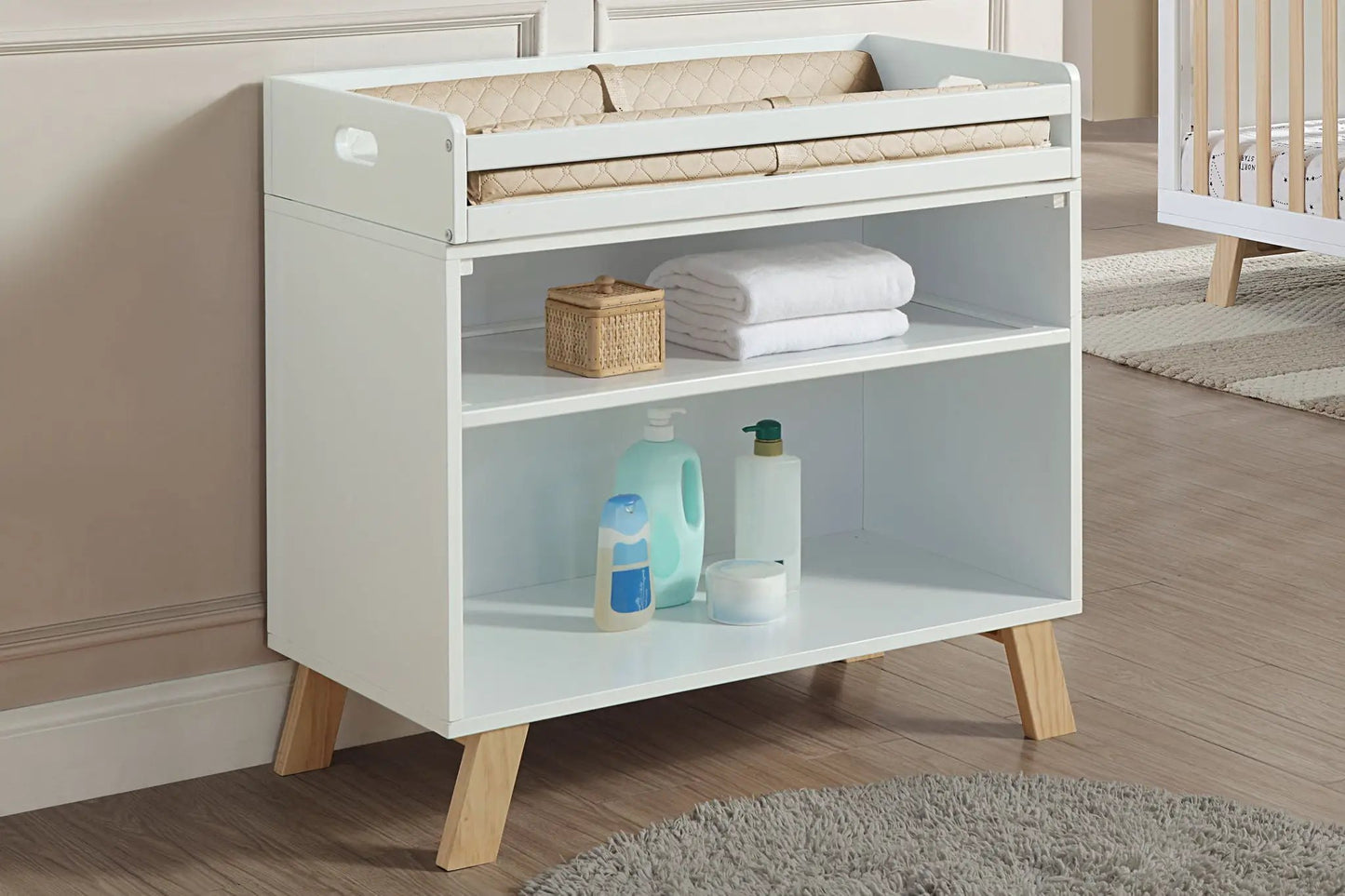 Livia changing table two-tone white and gray with beige quilted pad and wooden legs on Tampa Home & Garden Store