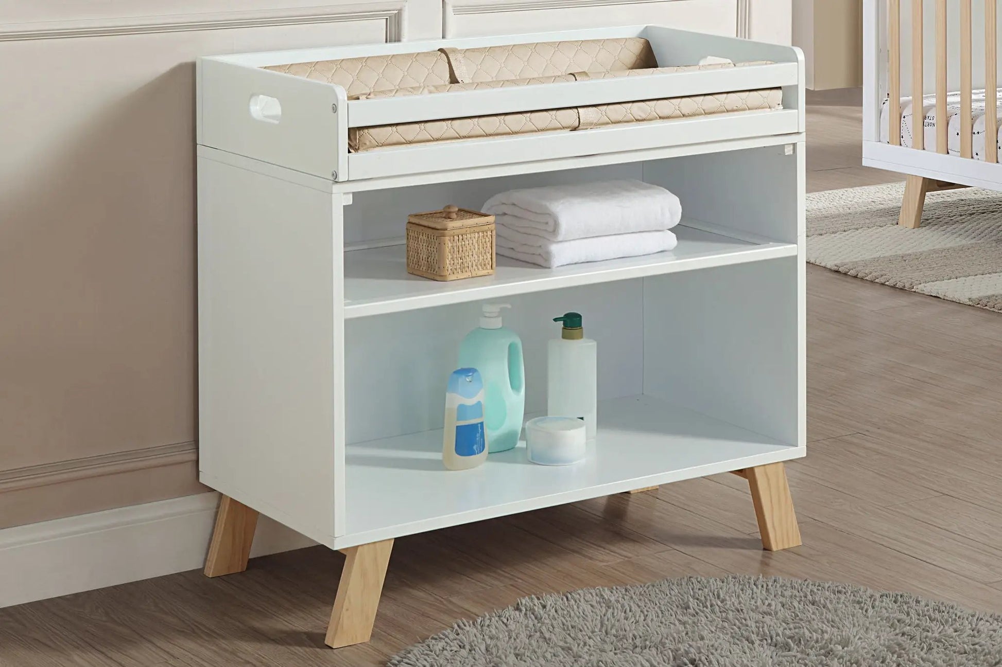 Livia changing table two-tone white and gray with beige quilted pad and wooden legs on Tampa Home & Garden Store