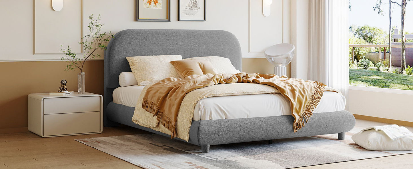 Upholstered platform bed by HouseOfZazla in grey fabric with thick curved frame on Tampa Home & Garden Store