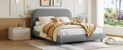 Upholstered platform bed by HouseOfZazla in grey fabric with thick curved frame on Tampa Home & Garden Store