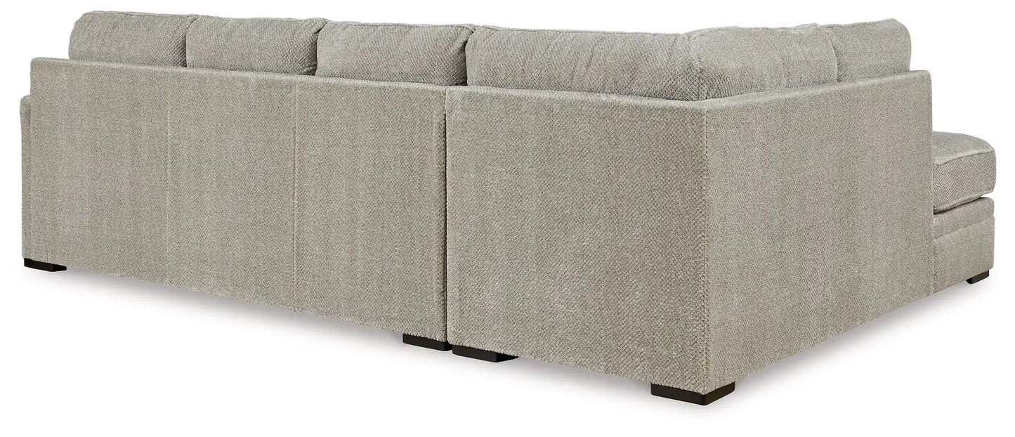 Calnita Sectional by Unique Piece Furniture in light gray boucle fabric with low-profile feet on Tampa Home & Garden Store